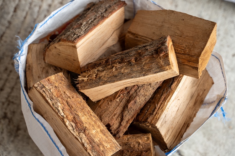 a large bag of kiln dried logs